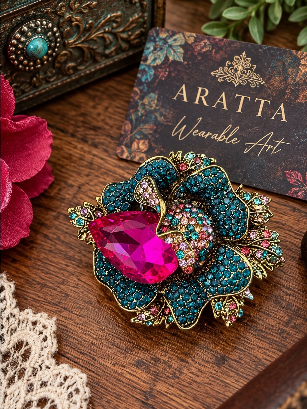 Sweet, sparkling cherry brooch featuring two dimensional cherries covered in bri